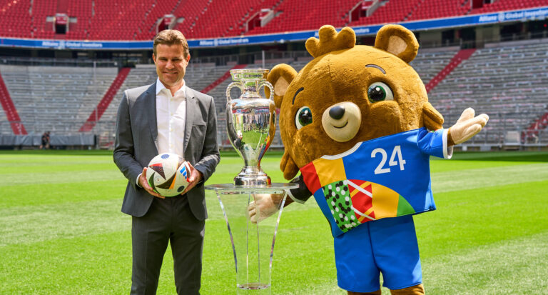 Munich, Bavaria, Germany - May 13, 2024: FIFA referee Felix Brych next to the Henri Delaunay Cup of UEFA EURO, EM, Europameisterschaft,Fussball 2024 on the soccer pitch at the Allianz Arena in Munich. EURO mascot Albärt next to the trophy *** FIFA Schiedsrichter Felix Brych neben dem Henri-Delaunay-Pokal der UEFA EURO 2024 auf dem Fußball Spielfeld der Allianz Arena in München. EM Maskottchen Albärt neben dem Pokal,Image: 872574710, License: Rights-managed, Restrictions: , Model Release: no, Credit line: Michael Bihlmayer / imago sport / Forum