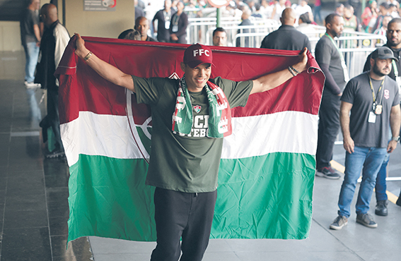 Soccer Football - Fluminense&#039;s new signing Thiago Silva arrives in Brazil - Antonio Carlos Jobim International Airport, Rio de Janeiro, Brazil - June 7, 2024 Fluminense&#039;s new signing Thiago Silva poses with a flag after arriving at the airport,Image: 879622967, License: Rights-managed, Restrictions: , Model Release: no, Credit line: Ricardo Moraes / Reuters / Forum