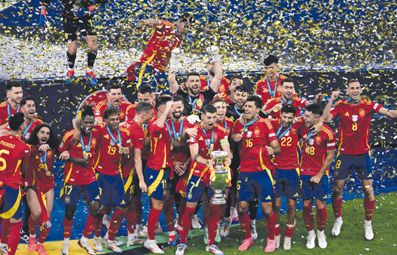 Soccer Football - Euro 2024 - Final - Spain v England - Berlin Olympiastadion, Berlin, Germany - July 14, 2024 Spain&#039;s Alvaro Morata lifts the trophy as he celebrates with teammates after winning Euro 2024,Image: 889720741, License: Rights-managed, Restrictions: , Model Release: no, Credit line: Angelika Warmuth / Reuters / Forum