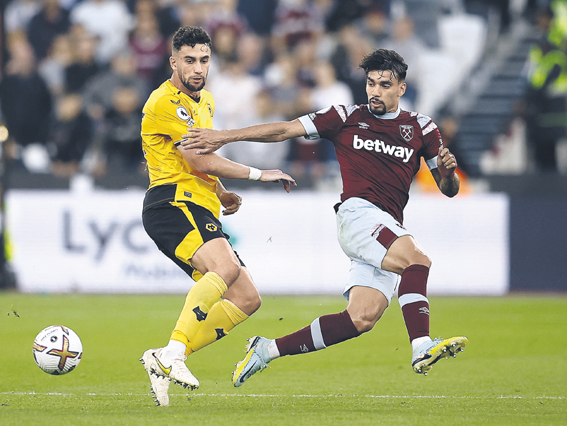 Soccer Football - Premier League - West Ham United v Wolverhampton Wanderers - London Stadium, London, Britain - October 1, 2022 Wolverhampton Wanderers&#039; Max Kilman in action with West Ham United&#039;s Lucas Paqueta  EDITORIAL USE ONLY. No use with unauthorized audio, video, data, fixture lists, club/league logos or &#039;live&#039; services. Online in-match use limited to 75 images, no video emulation. No use in betting, games or single club /league/player publications.  Please contact your account representative for further details.,Image: 727342479, License: Rights-managed, Restrictions: NO USE WITH UNAUTHORIZED AUDIO, VIDEO, DATA, FIXTURE LISTS, CLUB/LEAGUE LOGOS OR ‚ÄúLIVE‚ÄĚ SERVICES. ONLINE IN-MATCH USE LIMITED TO 45 IMAGES, NO VIDEO EMULATION. NO USE IN BETTING, GAMES OR SINGLE CLUB/LEAGUE/PLAYER PUBLICATIONS., Model Release: no, Credit line: PETER NICHOLLS / Reuters / Forum