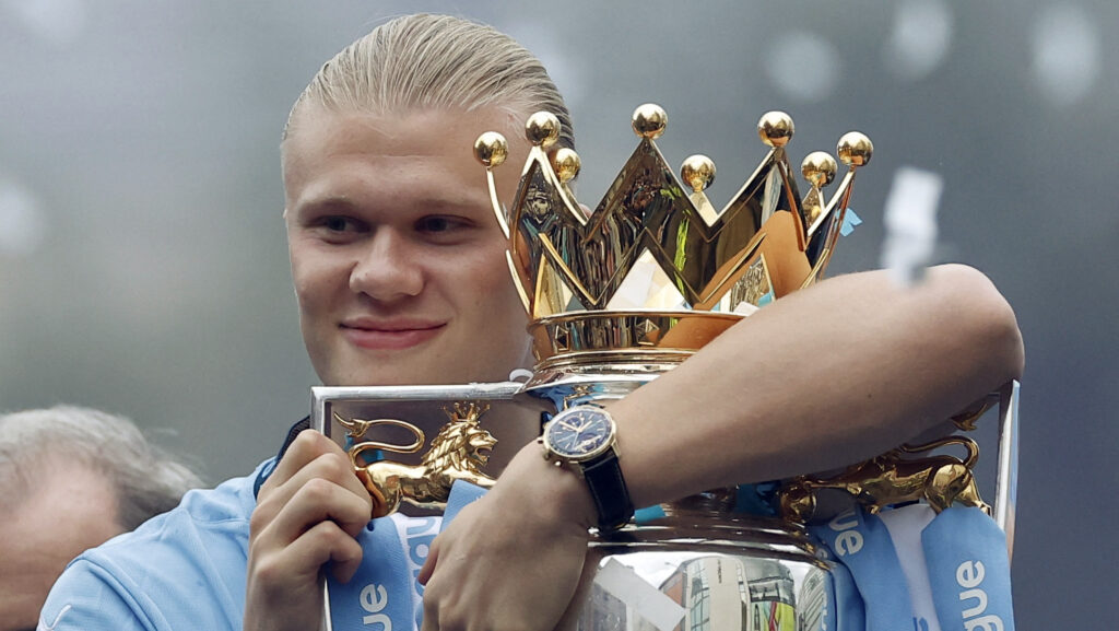 Soccer Football - Premier League - Manchester City Victory Parade - Manchester, Britain - May 26, 2024 Manchester City&#039;s Erling Braut Haaland holds the Premier League trophy on the bus during the victory parade  EDITORIAL USE ONLY. NO USE WITH UNAUTHORIZED AUDIO, VIDEO, DATA, FIXTURE LISTS, CLUB/LEAGUE LOGOS OR &#039;LIVE&#039; SERVICES. ONLINE IN-MATCH USE LIMITED TO 120 IMAGES, NO VIDEO EMULATION. NO USE IN BETTING, GAMES OR SINGLE CLUB/LEAGUE/PLAYER PUBLICATIONS. PLEASE CONTACT YOUR ACCOUNT REPRESENTATIVE FOR FURTHER DETAILS..,Image: 876677341, License: Rights-managed, Restrictions: NO USE WITH UNAUTHORIZED AUDIO, VIDEO, DATA, FIXTURE LISTS, CLUB/LEAGUE LOGOS OR “LIVE” SERVICES. ONLINE IN-MATCH USE LIMITED TO 45 IMAGES, NO VIDEO EMULATION. NO USE IN BETTING, GAMES OR SINGLE CLUB/LEAGUE/PLAYER PUBLICATIONS., Model Release: no, Credit line: Jason Cairnduff / Reuters / Forum