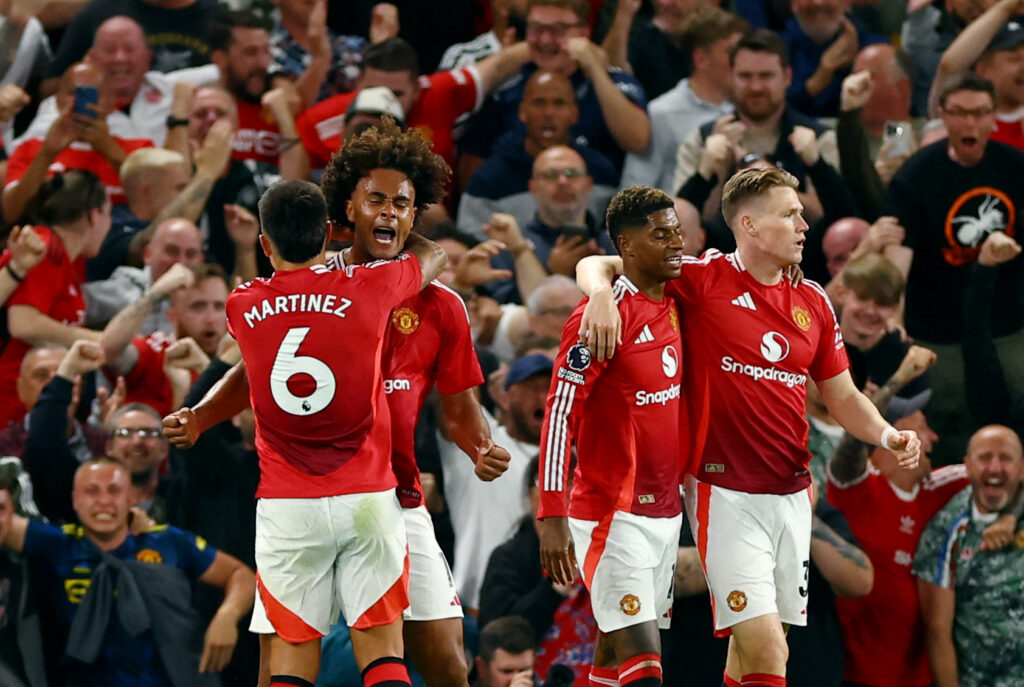 Soccer Football - Premier League - Manchester United v Fulham - Old Trafford, Manchester, Britain - August 16, 2024  Manchester United&#039;s Joshua Zirkzee celebrates scoring their first goal with Lisandro Martinez, Scott McTominay and Marcus Rashford  EDITORIAL USE ONLY. NO USE WITH UNAUTHORIZED AUDIO, VIDEO, DATA, FIXTURE LISTS, CLUB/LEAGUE LOGOS OR &#039;LIVE&#039; SERVICES. ONLINE IN-MATCH USE LIMITED TO 120 IMAGES, NO VIDEO EMULATION. NO USE IN BETTING, GAMES OR SINGLE CLUB/LEAGUE/PLAYER PUBLICATIONS. PLEASE CONTACT YOUR ACCOUNT REPRESENTATIVE FOR FURTHER DETAILS..,Image: 899295901, License: Rights-managed, Restrictions: NO USE WITH UNAUTHORIZED AUDIO, VIDEO, DATA, FIXTURE LISTS, CLUB/LEAGUE LOGOS OR “LIVE” SERVICES. ONLINE IN-MATCH USE LIMITED TO 45 IMAGES, NO VIDEO EMULATION. NO USE IN BETTING, GAMES OR SINGLE CLUB/LEAGUE/PLAYER PUBLICATIONS., Model Release: no, Credit line: Molly Darlington / Reuters / Forum