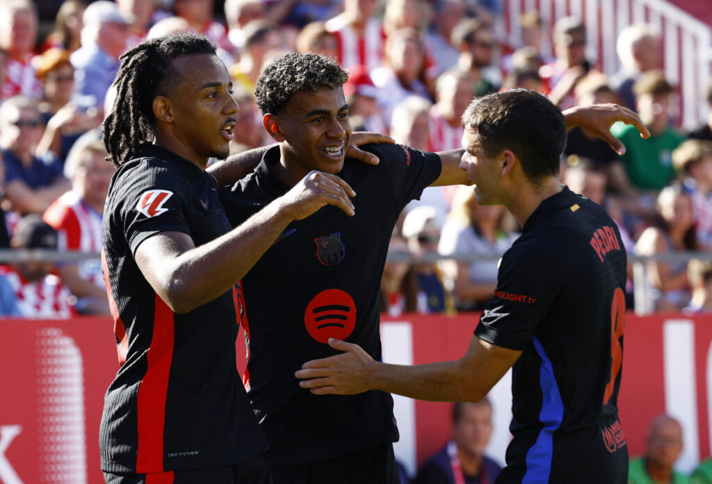 Soccer Football - LaLiga - Girona v FC Barcelona - Estadi Montilivi, Girona, Spain - September 15, 2024 FC Barcelona&#039;s Lamine Yamal celebrates scoring their first goal with Jules Kounde and Pedri,Image: 907921402, License: Rights-managed, Restrictions: , Model Release: no, Credit line: Albert Gea / Reuters / Forum