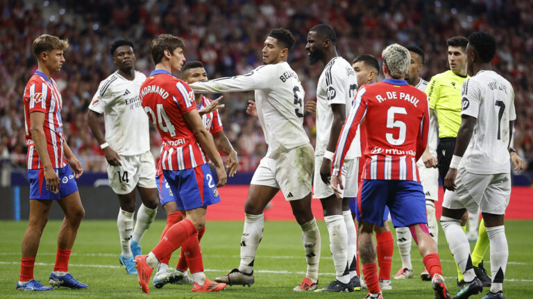 Soccer Football - LaLiga - Atletico Madrid v Real Madrid - Metropolitano, Madrid, Spain - September 29, 2024 Atletico Madrid&#039;s Robin Le Normand and Real Madrid&#039;s Jude Bellingham clash,Image: 913814803, License: Rights-managed, Restrictions: , Model Release: no, Credit line: Juan Medina / Reuters / Forum