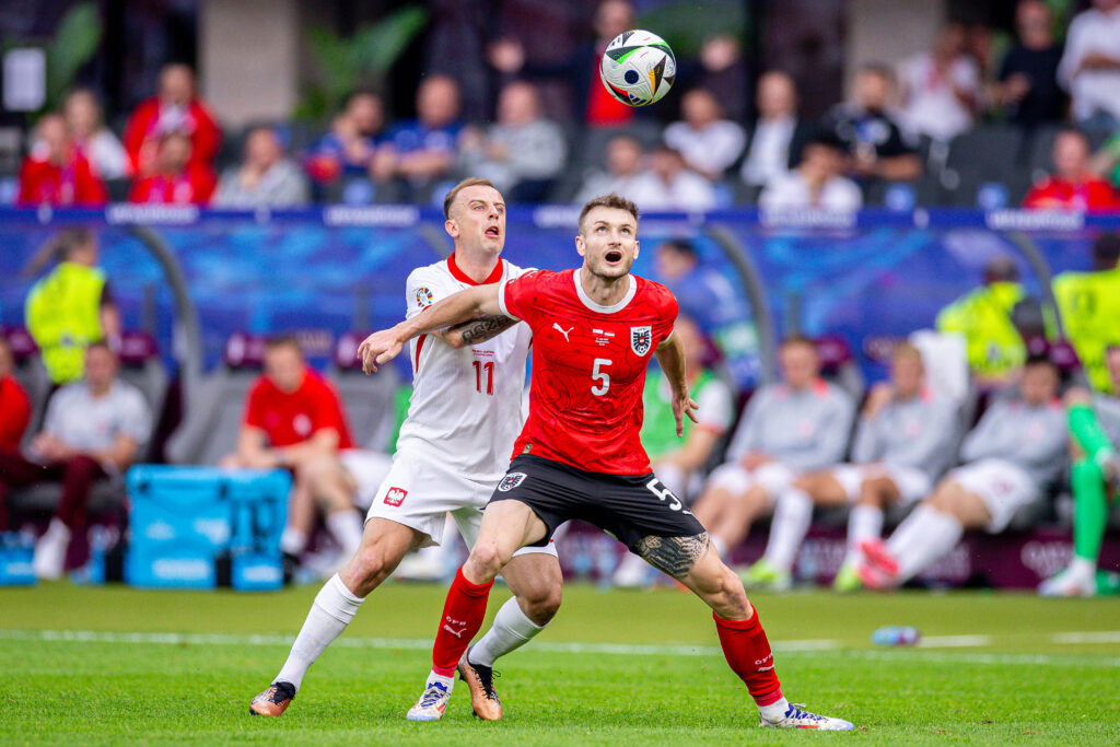 2024.06.21 Berlin
Stadion Olimpijski w Berlinie, Olympiastadion, UEFA Euro 2024, grupa D, Pilka nozna, 
Polska - Austria
N/z KAMIL GROSICKI Stefan Posch
Foto Mateusz Porzucek PressFocus

2024.06.21 Berlin
Football match between Poland and Austria, group D
Polska - Austria
KAMIL GROSICKI Stefan Posch
Credit: Mateusz Porzucek PressFocus