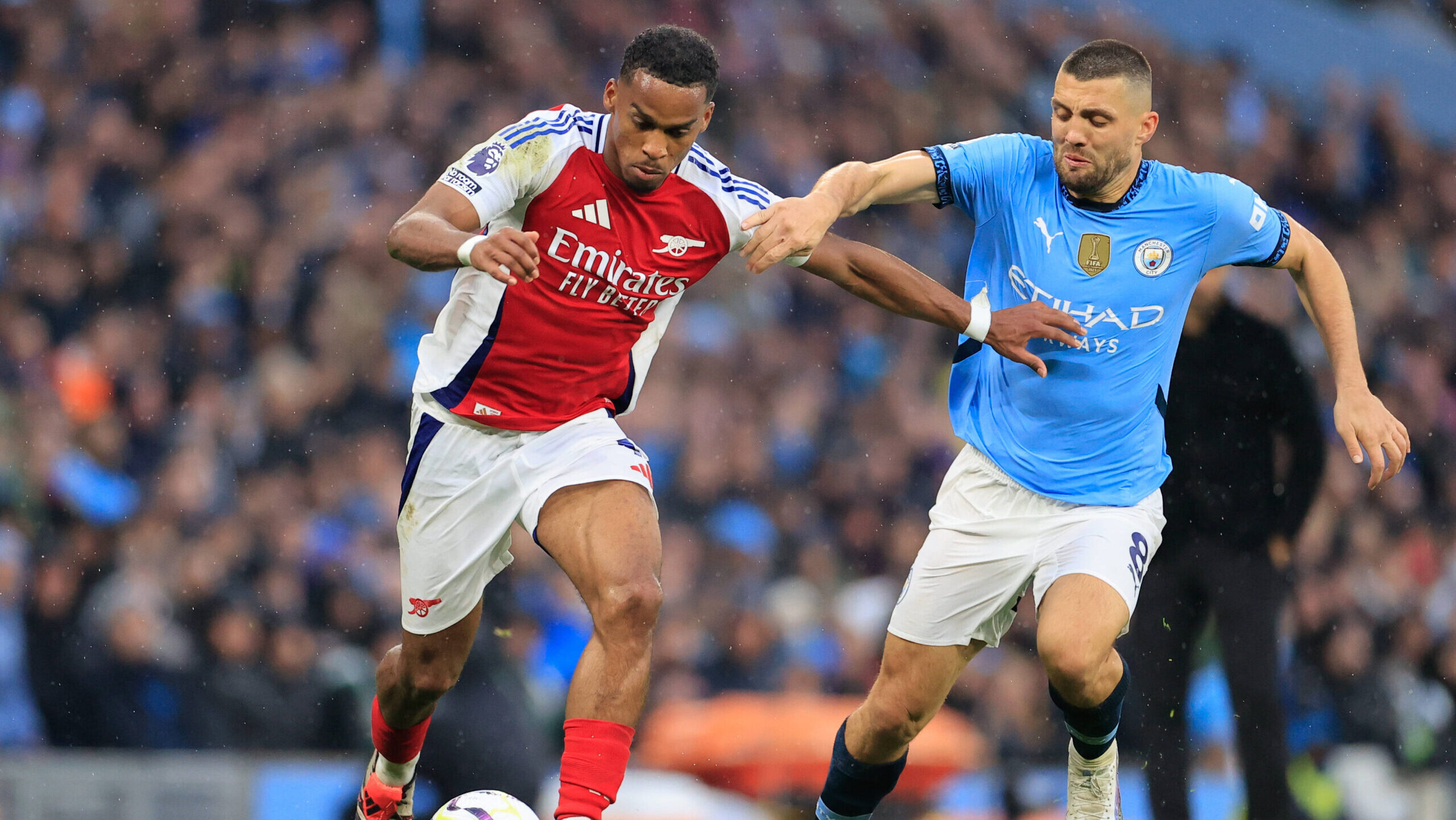 Manchester City v Arsenal Premier League 22/09/2024. Jurrien Timber 12 of Arsenal and Mateo Kovacic 8 of Manchester City challenge for the ball during the Premier League match between Manchester City and Arsenal at the Etihad Stadium, Manchester, England on 22 September 2024. Manchester Etihad Stadium Manchester England Editorial use only DataCo restrictions apply See www.football-dataco.com , Copyright: xConorxMolloyx PSI-20458-0181,Image: 911001347, License: Rights-managed, Restrictions: , Model Release: no, Credit line: Conor Molloy / imago sport / Forum