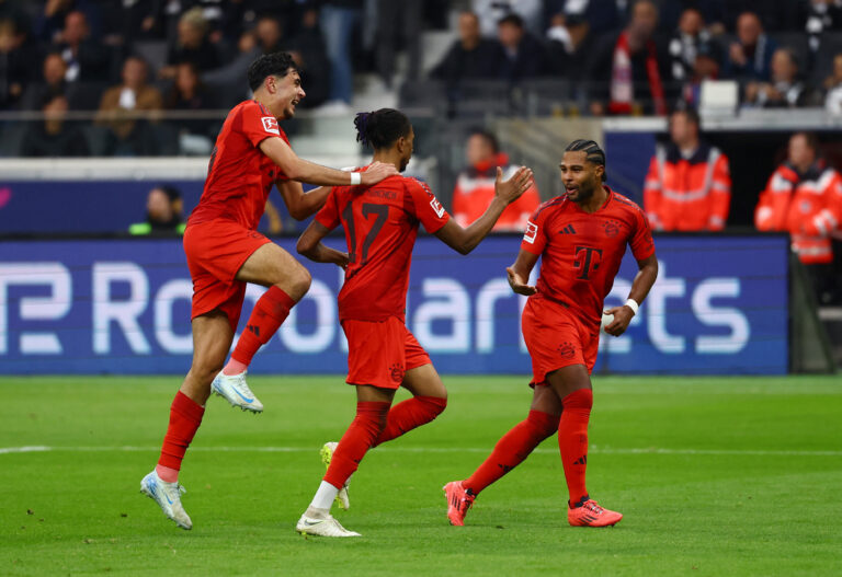 Soccer Football - Bundesliga - Eintracht Frankfurt v Bayern Munich - Deutsche Bank Park, Frankfurt, Germany - October 6, 2024  Bayern Munich&#039;s Michael Olise celebrates scoring their third goal with Serge Gnabry and Aleksandar Pavlovic  DFL REGULATIONS PROHIBIT ANY USE OF PHOTOGRAPHS AS IMAGE SEQUENCES AND/OR QUASI-VIDEO.,Image: 917271240, License: Rights-managed, Restrictions: DFL RULES TO LIMIT THE ONLINE USAGE DURING MATCH TIME TO 15 PICTURES PER GAME. IMAGE SEQUENCES TO SIMULATE VIDEO IS NOT ALLOWED AT ANY TIME. FOR FURTHER QUERIES PLEASE CONTACT DFL DIRECTLY AT + 49 69 650050, Model Release: no, Credit line: Kai Pfaffenbach / Reuters / Forum