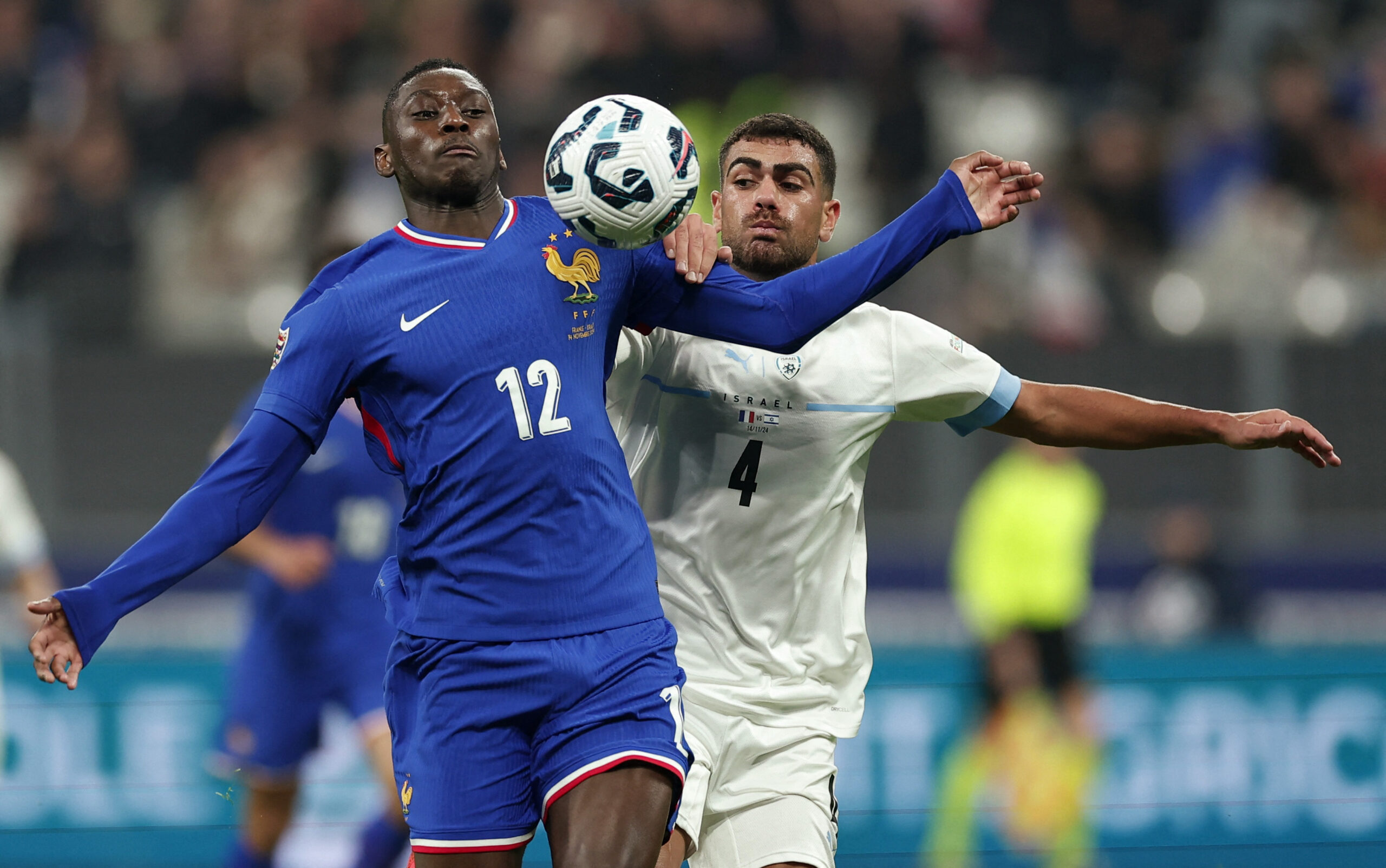 Soccer Football - Nations League - Group Stage - France v Israel - Stade de France, Saint-Denis, France  - November 14, 2024 France&#039;s Randal Kolo Muani in action with Israel&#039;s Raz Shlomo,Image: 934481374, License: Rights-managed, Restrictions: , Model Release: no, Credit line: Gonzalo Fuentes / Reuters / Forum