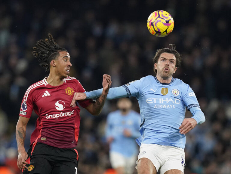 Manchester, England, 15th December 2024. Jack Grealish of Manchester City R is challenged by Lent Yoro of Manchester United, ManU during the Premier League match at the Etihad Stadium, Manchester. Picture credit should read: Andrew Yates / Sportimage EDITORIAL USE ONLY. No use with unauthorised audio, video, data, fixture lists, club/league logos or live services. Online in-match use limited to 120 images, no video emulation. No use in betting, games or single club/league/player publications. SPI-3541-0145
2024.12.15 Manchester
pilka nozna liga angielska
Manchester City - Manchester United - Premier League - Etihad Stadium
Foto IMAGO/PressFocus

!!! POLAND ONLY !!!