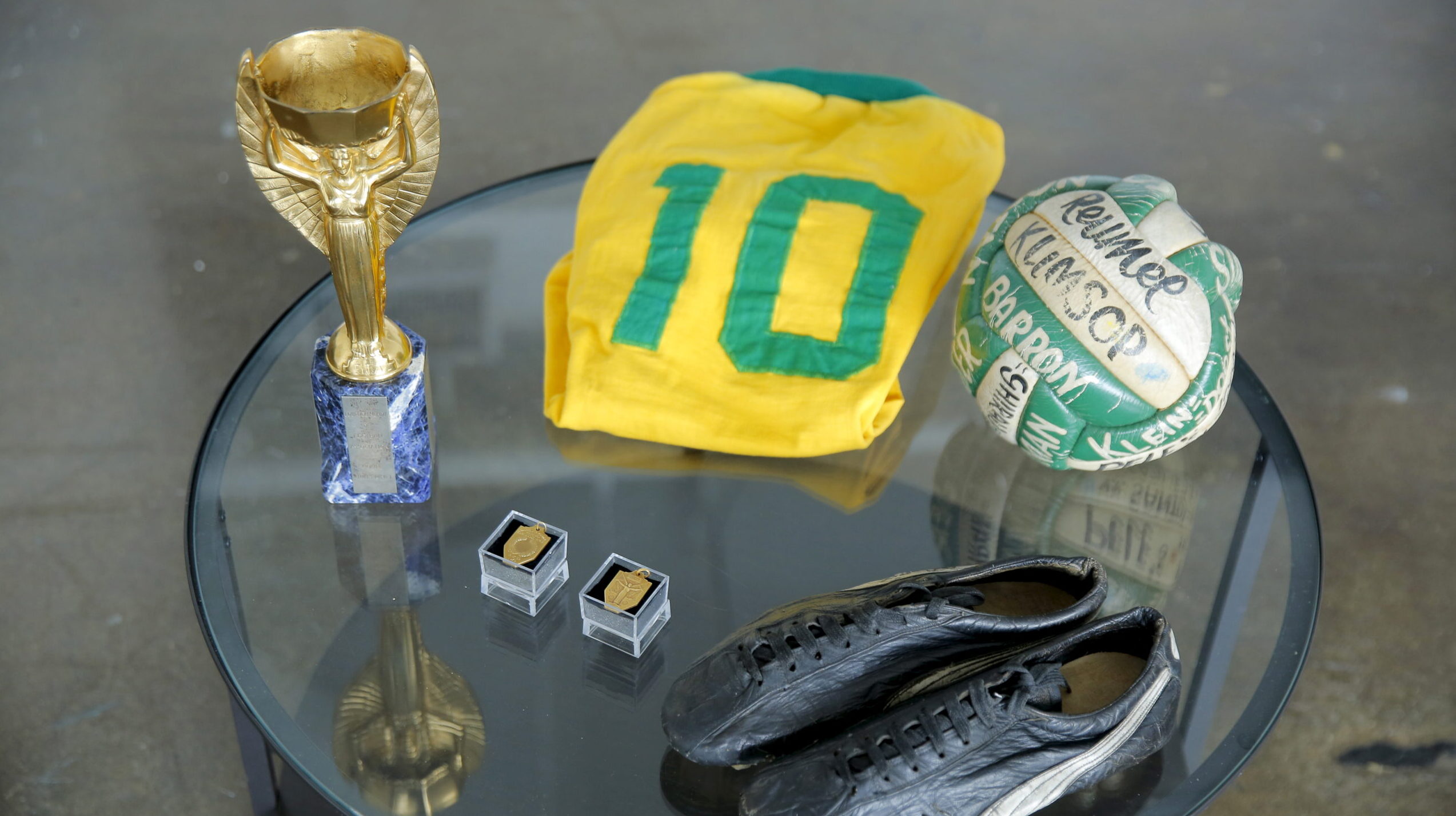 Memorabilia to be auctioned off by legendary Brazilian soccer player Pele, including a 1958 World Cup trophy, rests on a table during an interview in New York, U.S., April 26, 2016.,Image: 441150190, License: Rights-managed, Restrictions: , Model Release: no, Credit line: Lucas Jackson / Reuters / Forum