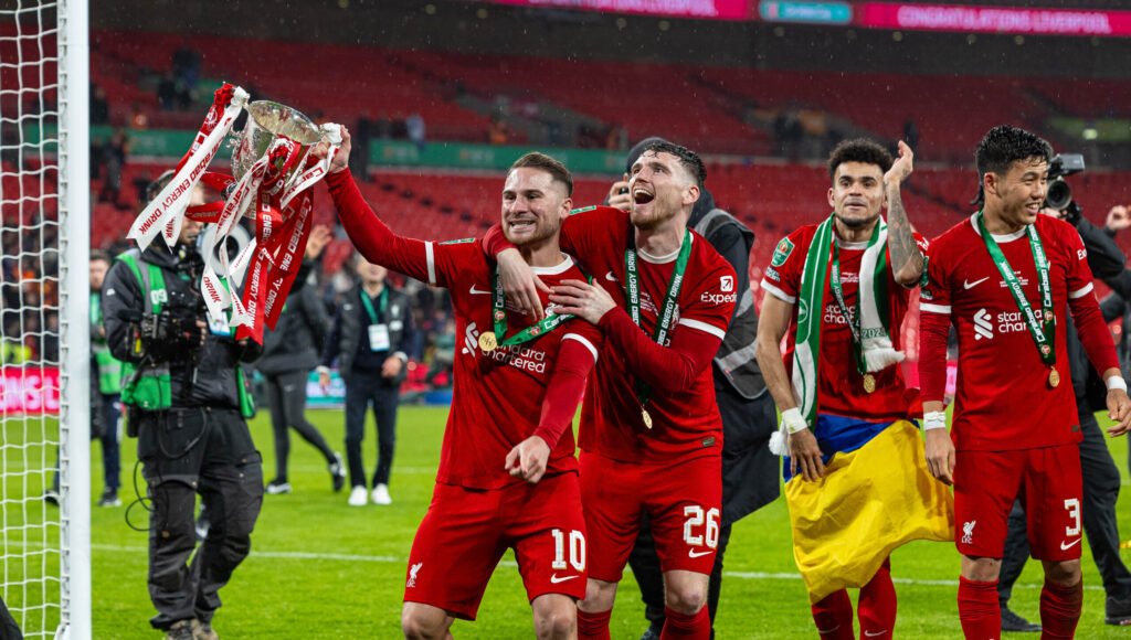 (240226) -- LONDON, Feb. 26, 2024 (Xinhua) Liverpool&#039;s Alexis Mac Allister (1st, L) and Andy Robertson (2nd, L) celebrate with the trophy after the English Football League Cup final match between Chelsea and Liverpool in London, Britain, on Feb. 25, 2024. (Xinhua)
FOR EDITORIAL USE ONLY. NOT FOR SALE FOR MARKETING OR ADVERTISING CAMPAIGNS. NO USE WITH UNAUTHORIZED AUDIO, VIDEO, DATA, FIXTURE LISTS, CLUB/LEAGUE LOGOS OR &quot;LIVE&quot; SERVICES. ONLINE IN-MATCH USE LIMITED TO 45 IMAGES, NO VIDEO EMULATION. NO USE IN BETTING, GAMES OR SINGLE CLUB/LEAGUE/PLAYER PUBLICATIONS.

2024.02.25 Londyn
pilka nozna puchar ligi angielskiej , final
Chelsea Londyn - FC Liverpool
Foto (Xinhua)/Xinhua/PressFocus

!!! POLAND ONLY !!!