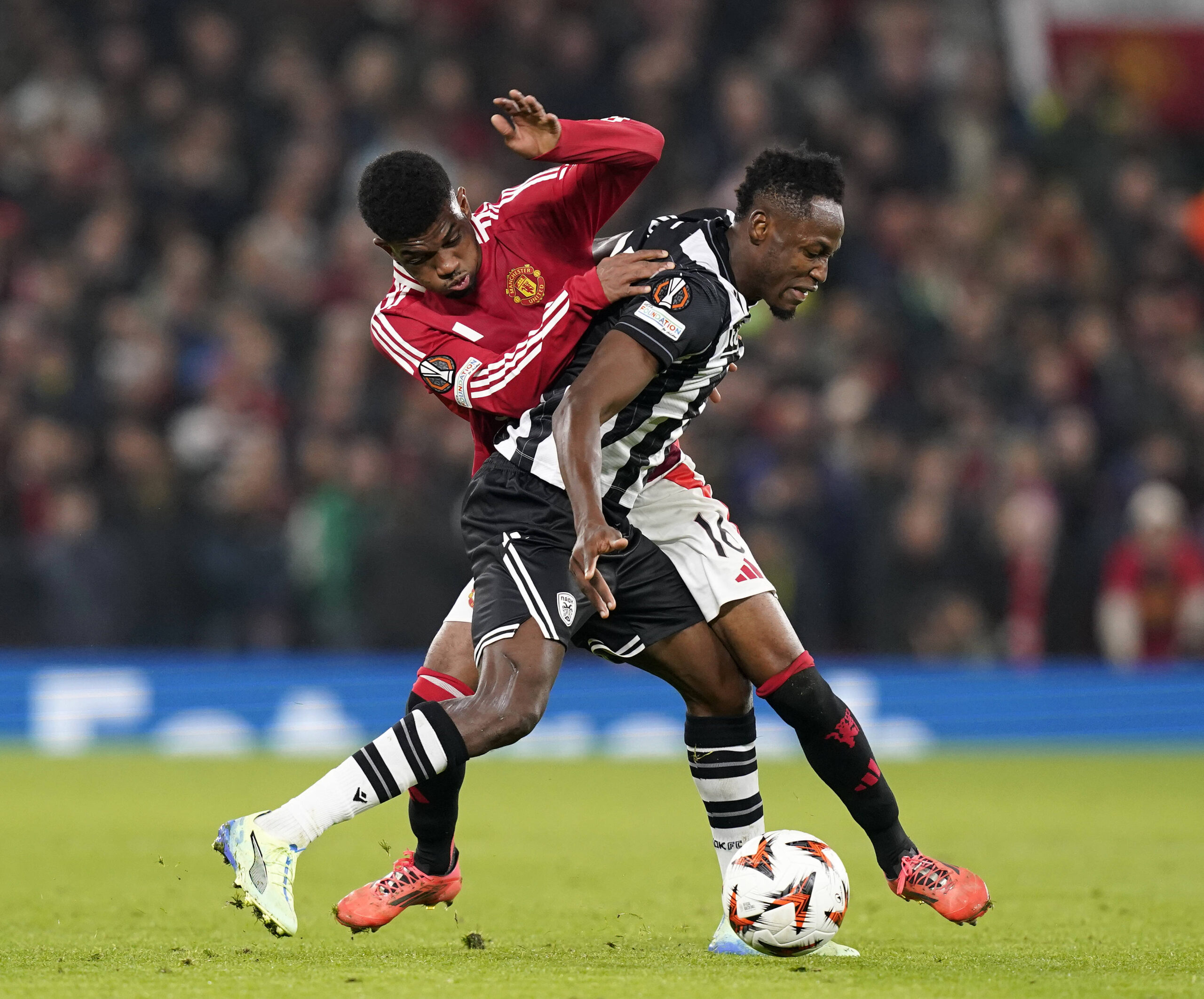 Manchester, England, 7th November 2024. Amad Diallo of Manchester United, ManU with PAOKs Tiemoue Bakayoko during the UEFA Europa League match at Old Trafford, Manchester. Picture credit should read: Andrew Yates / Sportimage EDITORIAL USE ONLY. No use with unauthorised audio, video, data, fixture lists, club/league logos or live services. Online in-match use limited to 120 images, no video emulation. No use in betting, games or single club/league/player publications. SPI-3442-0056
2024.11.07 Manchester
pilka nozna liga europy
Manchester United - PAOK Saloniki
Foto IMAGO/PressFocus

!!! POLAND ONLY !!!